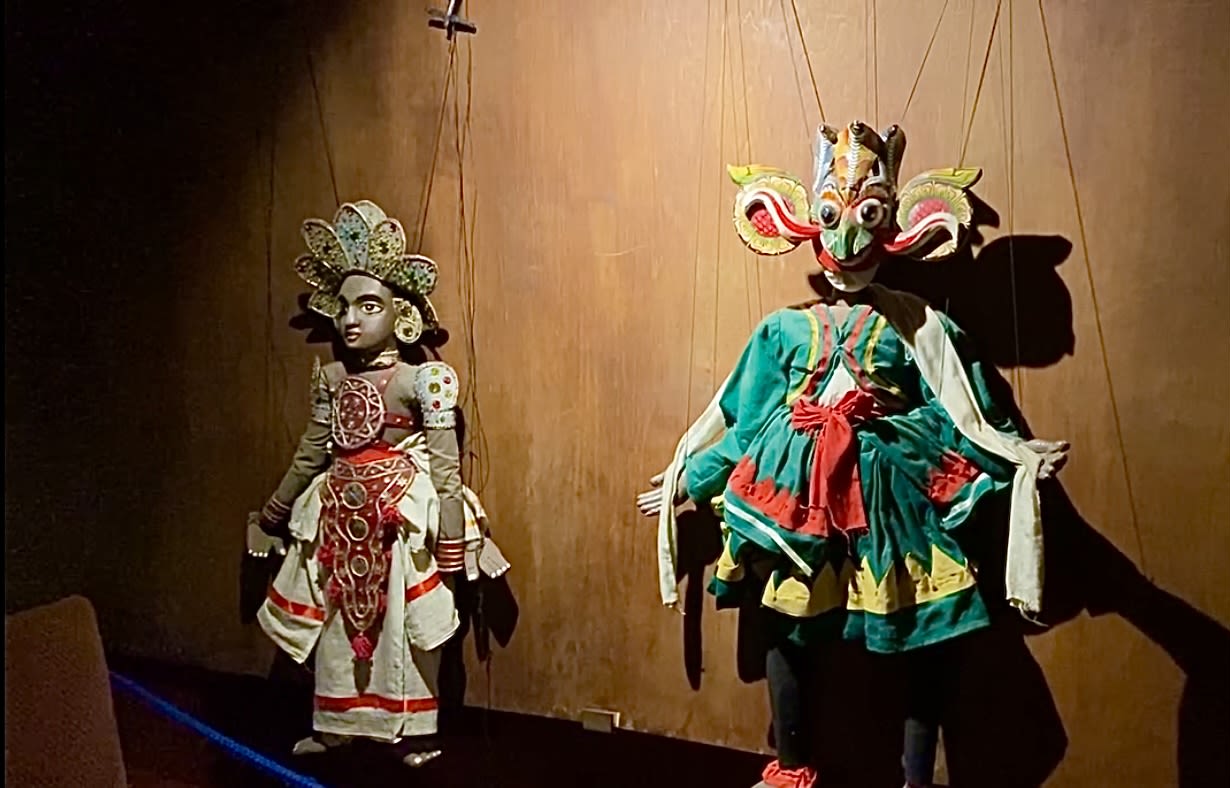 selective focus photography of deity marionettes