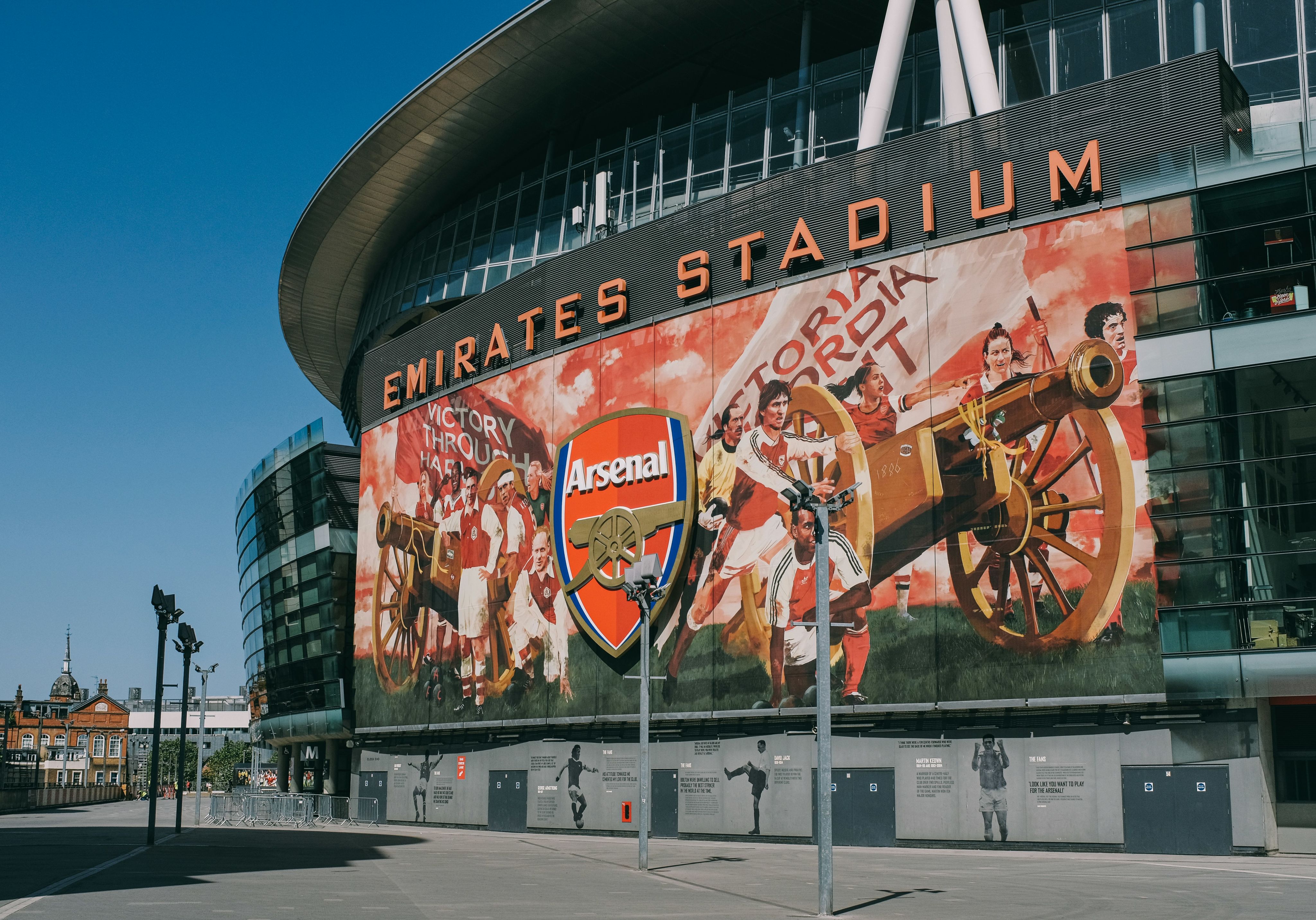 a stadium with a large mural on the side of it